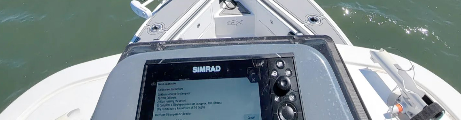 Two men fishing in the ocean on a boat equipped with marine electronics installed by C&S Marine Electrical in Newport, North Carolina.