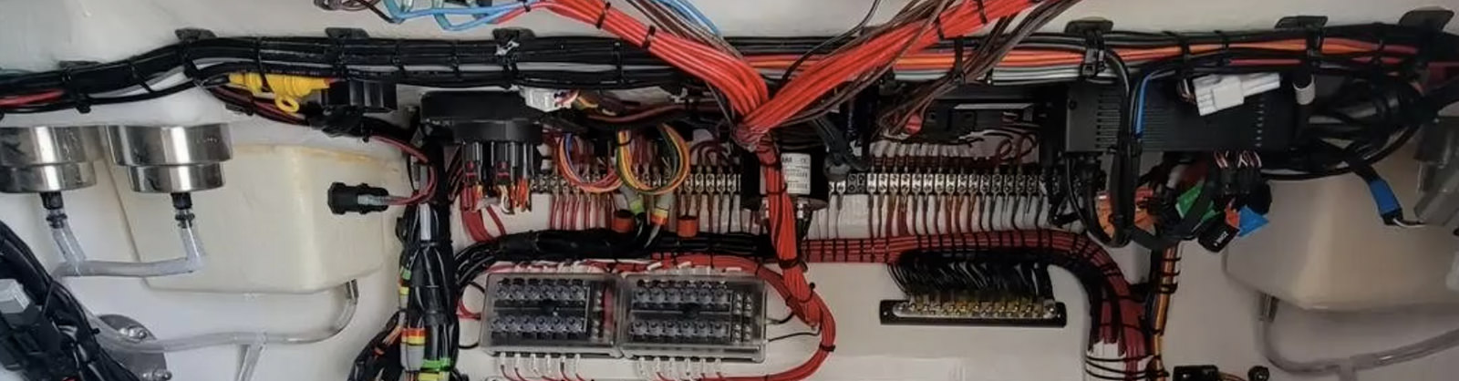 Complex wiring bundles, neatly organized and secured by C&S Marine Electrical in Newport, North Carolina.